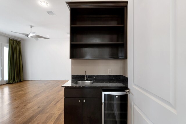 6011 Burgoyne Rd Unit A, Houston, TX 77057 - indoor wet bar featuring wine cooler, wood finished floors, baseboards, ceiling fan, and recessed lighting