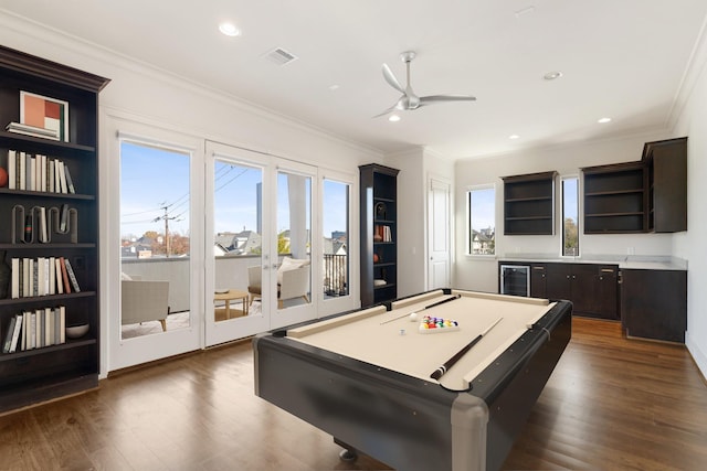 game room featuring wine cooler, ornamental molding, dark wood-style flooring, and ceiling fan