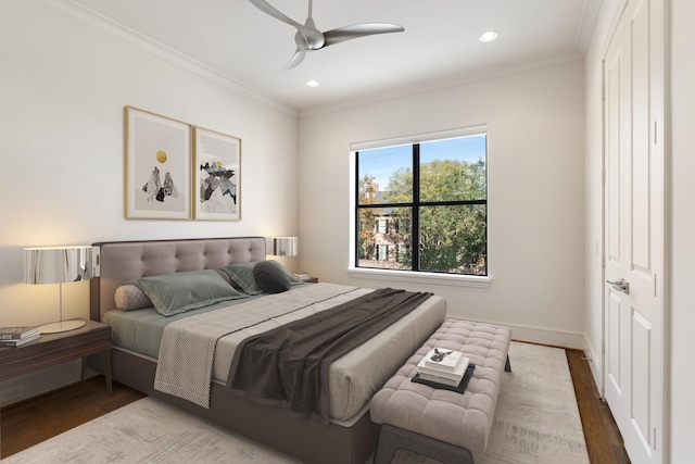 bedroom featuring crown molding, recessed lighting, and wood finished floors
