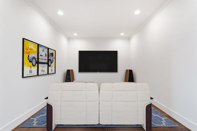 living area with baseboards, ornamental molding, wood finished floors, and recessed lighting