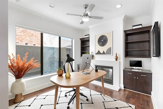 6011 Burgoyne Rd Unit A, Houston, TX 77057 - home office featuring a glass covered fireplace, dark wood finished floors, crown molding, ceiling fan, and recessed lighting