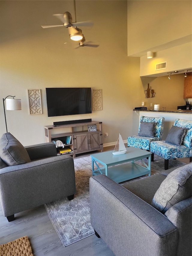 3922 Lakewood Dr, Montgomery, TX 77356 - living room with a high ceiling, a ceiling fan, wood finished floors, and visible vents