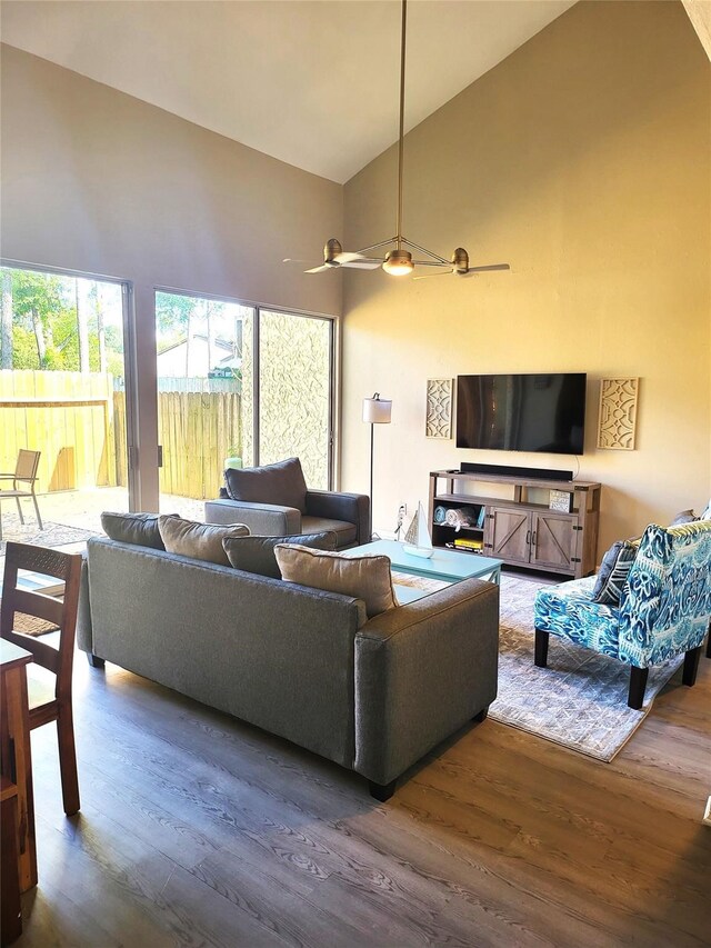 3922 Lakewood Dr, Montgomery, TX 77356 - living area with high vaulted ceiling, ceiling fan, and wood finished floors