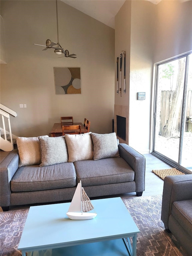 3922 Lakewood Dr, Montgomery, TX 77356 - living area with high vaulted ceiling, wood finished floors, and a fireplace