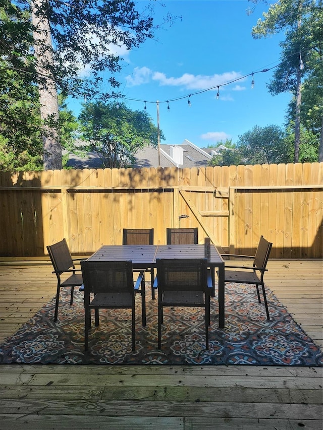 3922 Lakewood Dr, Montgomery, TX 77356 - wooden deck with fence and outdoor dining space