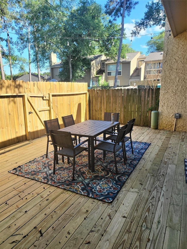 3922 Lakewood Dr, Montgomery, TX 77356 - wooden deck with fence and outdoor dining space