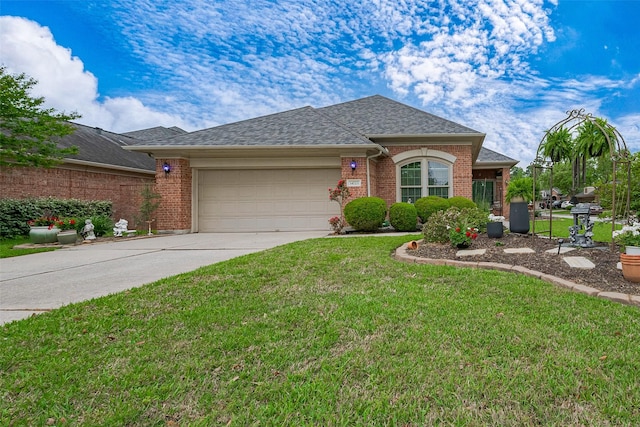 ranch-style house featuring concrete driveway, a shingled roof, a front lawn, and a garage