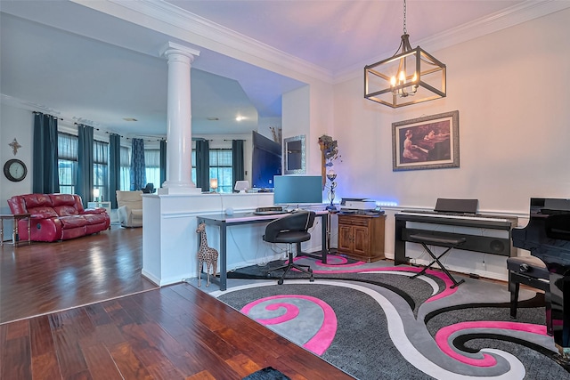 office area with ornate columns, ornamental molding, wood finished floors, and an inviting chandelier