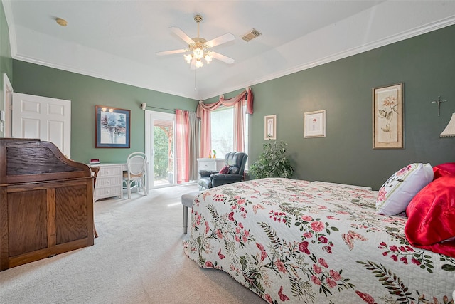 carpeted bedroom featuring visible vents, ornamental molding, access to exterior, a raised ceiling, and a ceiling fan