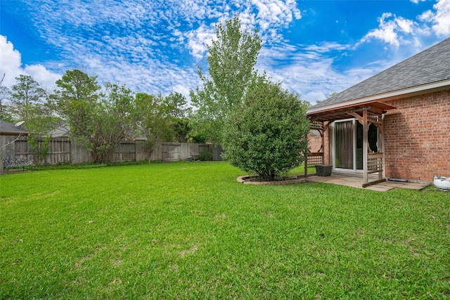 view of yard featuring a patio and a fenced backyard