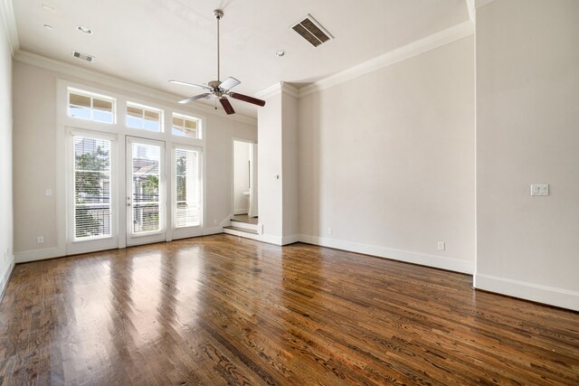 unfurnished living room with visible vents, a ceiling fan, and crown molding