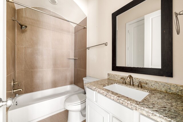 bathroom featuring shower / tub combination, toilet, and vanity
