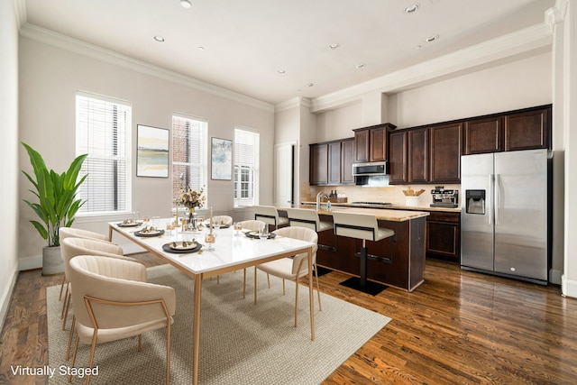 dining space with recessed lighting, ornamental molding, baseboards, and dark wood-style floors