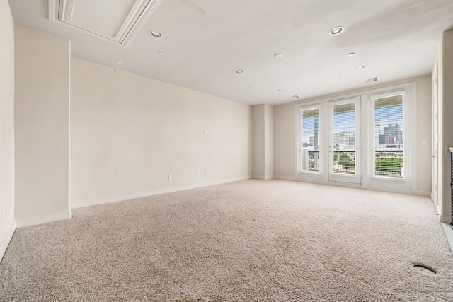 1027 Saint Charles St, Houston, TX 77003 - carpeted empty room with attic access, baseboards, and recessed lighting