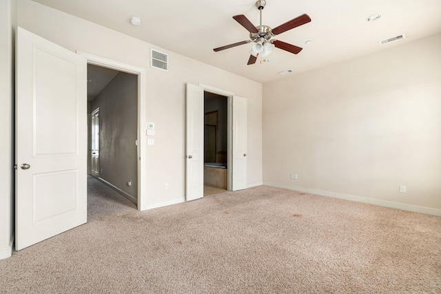 unfurnished bedroom with visible vents, carpet flooring, and baseboards