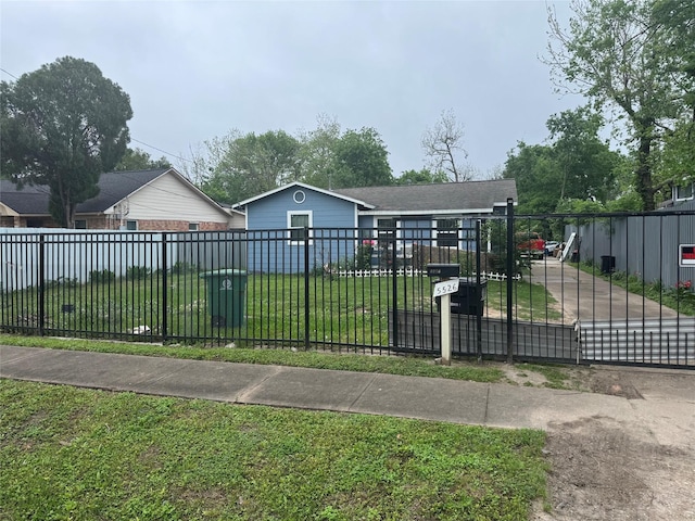 5526 Bunte St, Houston, TX 77026 - view of front of home with fence, a gate, and a front yard
