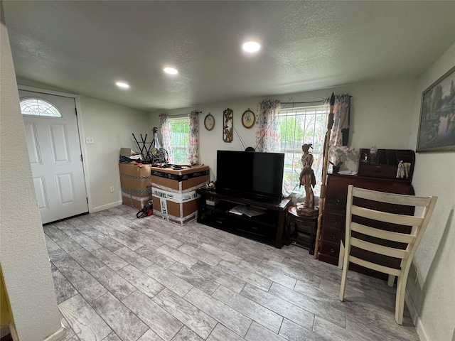 5526 Bunte St, Houston, TX 77026 - living room with recessed lighting and a textured ceiling