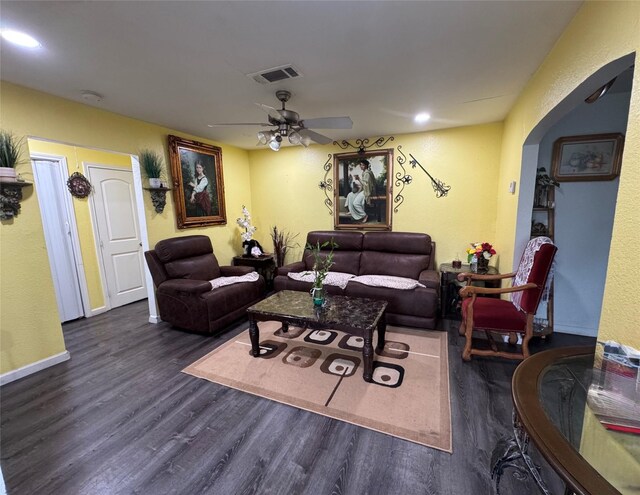 5526 Bunte St, Houston, TX 77026 - living area with a ceiling fan, visible vents, arched walkways, wood finished floors, and baseboards