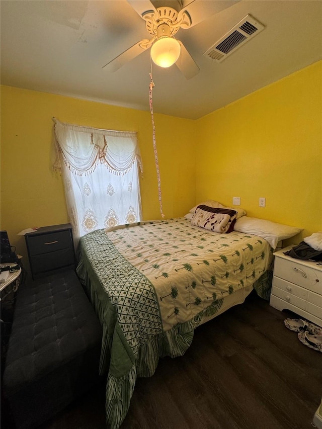 5526 Bunte St, Houston, TX 77026 - bedroom featuring ceiling fan, wood finished floors, and visible vents