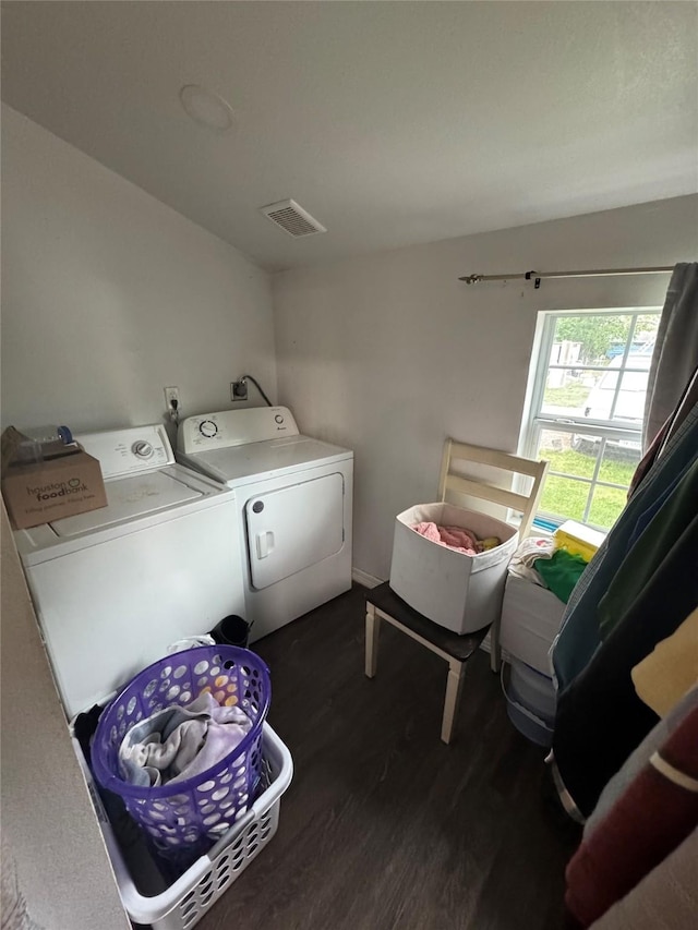 5526 Bunte St, Houston, TX 77026 - washroom with dark wood-style flooring, laundry area, visible vents, and washer and clothes dryer