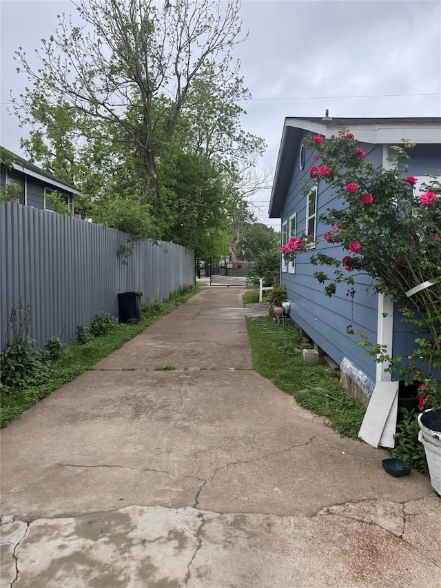 5526 Bunte St, Houston, TX 77026 - view of home's exterior with fence and concrete driveway
