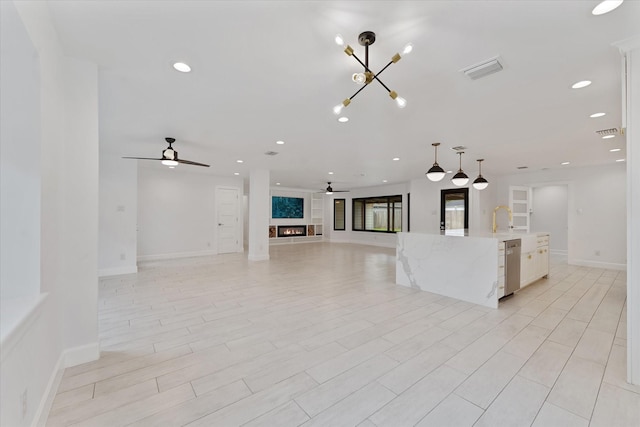 2611 Teague Rd, Houston, TX 77080 - kitchen with visible vents, recessed lighting, open floor plan, a ceiling fan, and stainless steel dishwasher