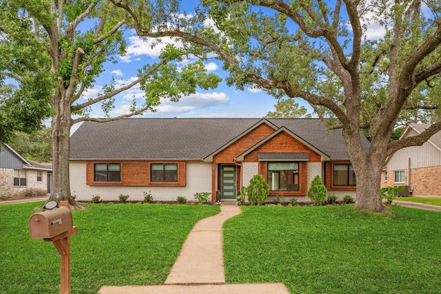 2611 Teague Rd, Houston, TX 77080 - ranch-style home featuring a shingled roof, a front lawn, and brick siding