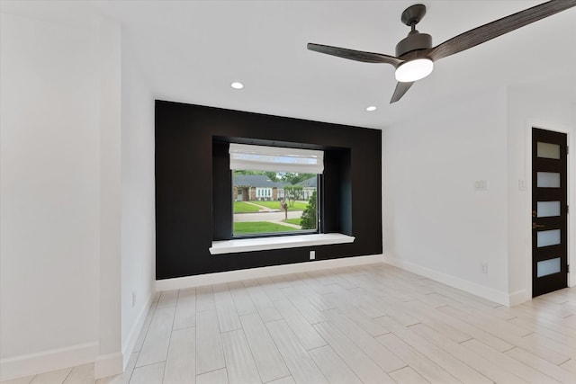 2611 Teague Rd, Houston, TX 77080 - unfurnished room with baseboards, light wood-style flooring, ceiling fan, and recessed lighting
