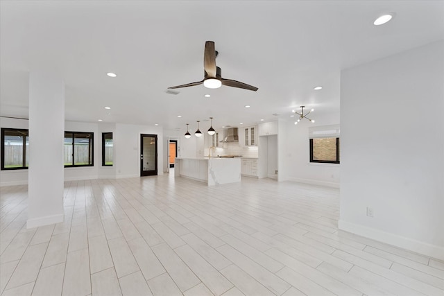 2611 Teague Rd, Houston, TX 77080 - unfurnished living room featuring baseboards, a ceiling fan, and recessed lighting