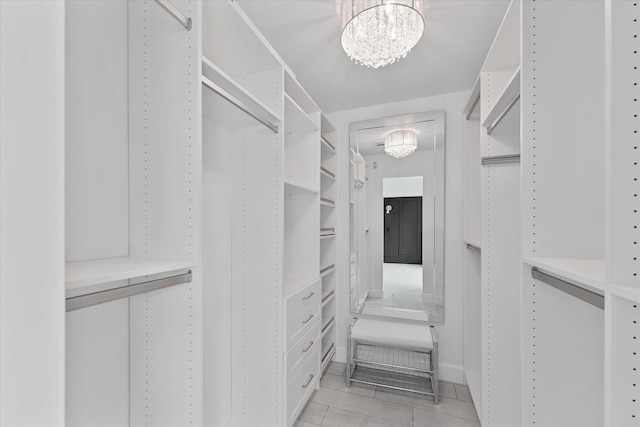 2611 Teague Rd, Houston, TX 77080 - spacious closet with light tile patterned floors and an inviting chandelier