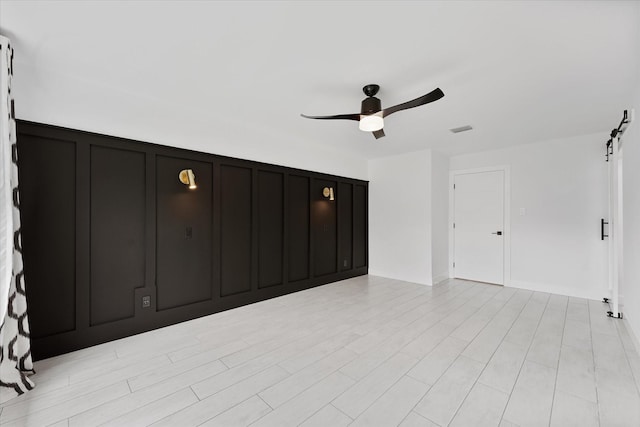 2611 Teague Rd, Houston, TX 77080 - unfurnished bedroom with ceiling fan, a decorative wall, and visible vents