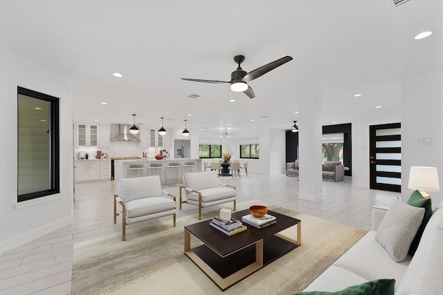 2611 Teague Rd, Houston, TX 77080 - living room with visible vents, baseboards, ceiling fan, and recessed lighting