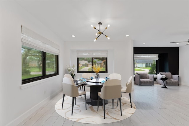 2611 Teague Rd, Houston, TX 77080 - dining room featuring wood finished floors, a notable chandelier, baseboards, and recessed lighting