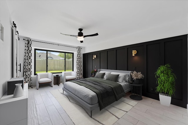 2611 Teague Rd, Houston, TX 77080 - bedroom featuring ceiling fan and a barn door