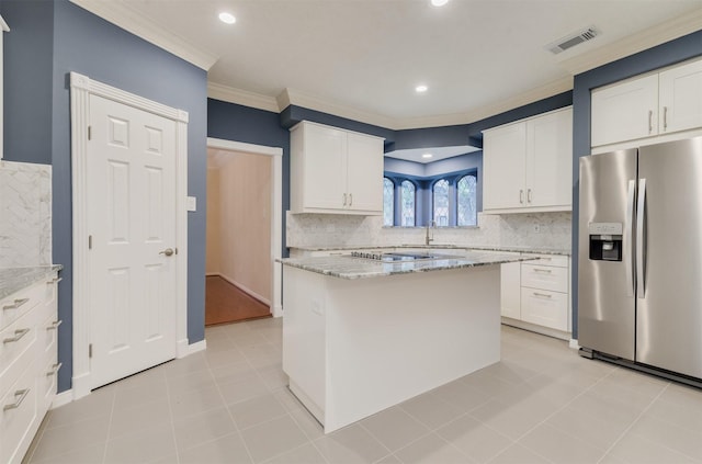 714 Last Arrow Dr, Houston, TX 77079 - kitchen featuring stainless steel fridge with ice dispenser, ornamental molding, white cabinetry, light stone countertops, and tasteful backsplash