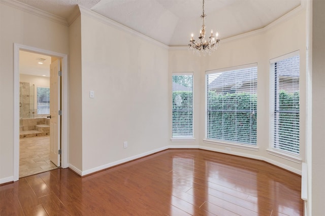 714 Last Arrow Dr, Houston, TX 77079 - spare room featuring wood finished floors, a chandelier, ornamental molding, and baseboards