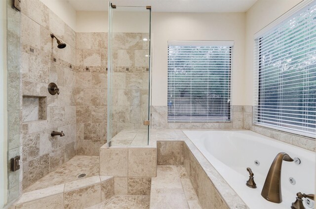 714 Last Arrow Dr, Houston, TX 77079 - bathroom featuring a whirlpool tub, a stall shower, and plenty of natural light