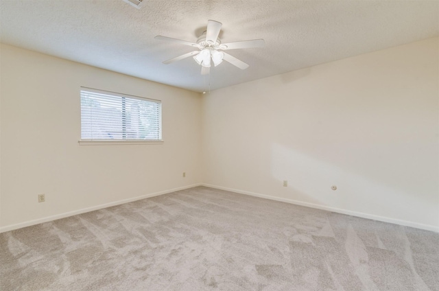 714 Last Arrow Dr, Houston, TX 77079 - unfurnished room featuring carpet, a ceiling fan, baseboards, and a textured ceiling