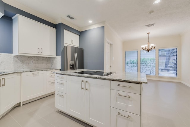 714 Last Arrow Dr, Houston, TX 77079 - kitchen featuring black electric stovetop, stainless steel fridge with ice dispenser, ornamental molding, tasteful backsplash, and a chandelier