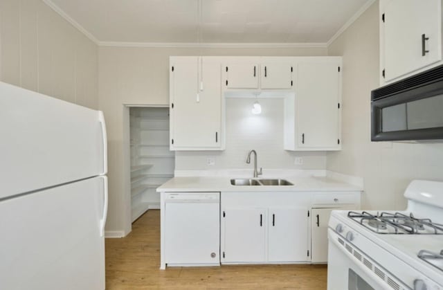 219 W 13th St, Houston, TX 77008 - kitchen featuring a sink, light countertops, white appliances, and white cabinetry