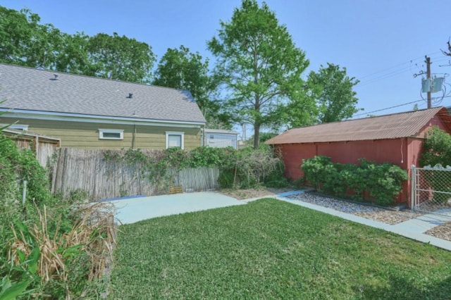 219 W 13th St, Houston, TX 77008 - view of yard with fence and an outbuilding