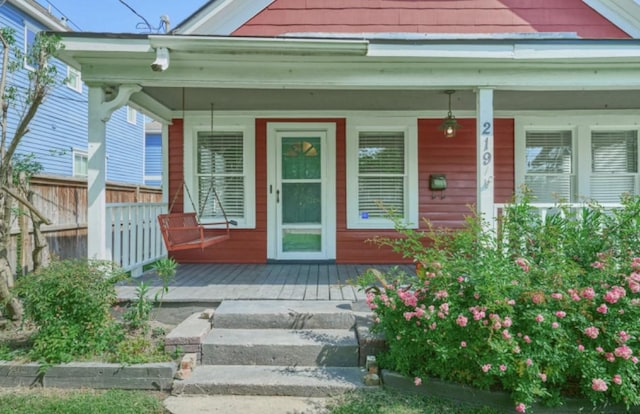 219 W 13th St, Houston, TX 77008 - view of exterior entry with covered porch and fence