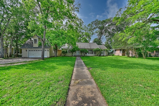 708 4th St, Sealy, TX 77474 - view of front of home with a front yard, a garage, and driveway