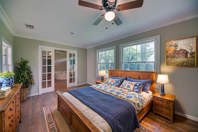 708 4th St, Sealy, TX 77474 - bedroom featuring french doors, crown molding, dark wood-style flooring, and baseboards
