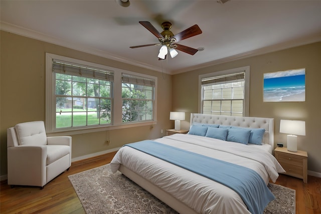 708 4th St, Sealy, TX 77474 - bedroom with ornamental molding, multiple windows, baseboards, and wood finished floors