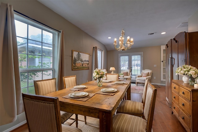 708 4th St, Sealy, TX 77474 - dining area with a chandelier, wood finished floors, recessed lighting, lofted ceiling, and baseboards