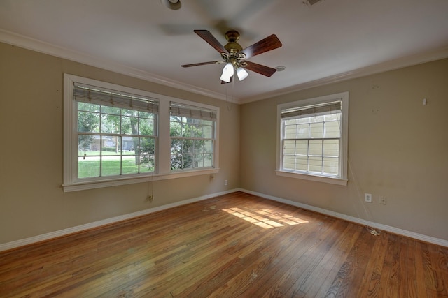 708 4th St, Sealy, TX 77474 - spare room featuring crown molding, baseboards, wood-type flooring, and a ceiling fan
