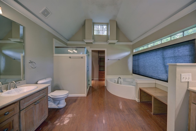 708 4th St, Sealy, TX 77474 - bathroom with vanity, a garden tub, a walk in shower, wood finished floors, and healthy amount of natural light