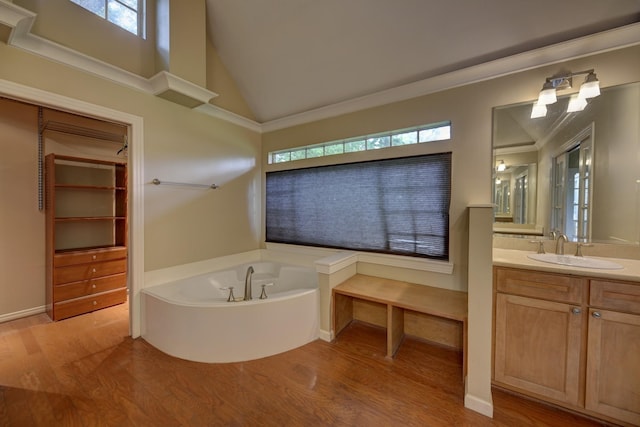 708 4th St, Sealy, TX 77474 - full bath with wood finished floors, plenty of natural light, a bath, and lofted ceiling