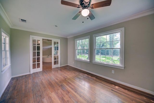 708 4th St, Sealy, TX 77474 - spare room featuring french doors, ornamental molding, baseboards, wood finished floors, and a ceiling fan
